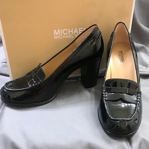 New in the box!  Michael Kors black patent pumps.
